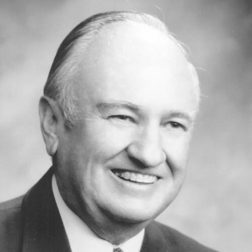 CARROLL E. BROCK